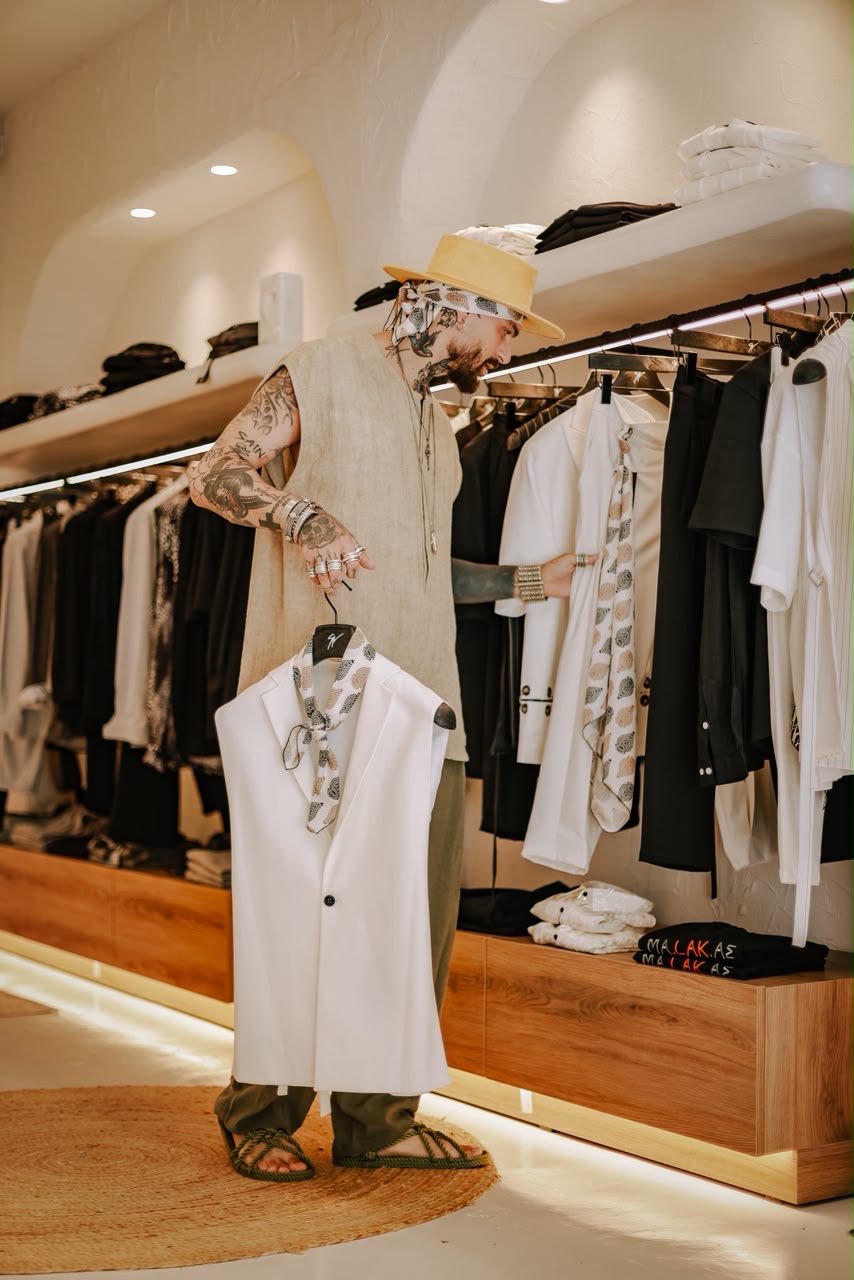 Designer selecting pieces from the rack